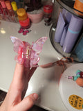 Pince papillon mauve